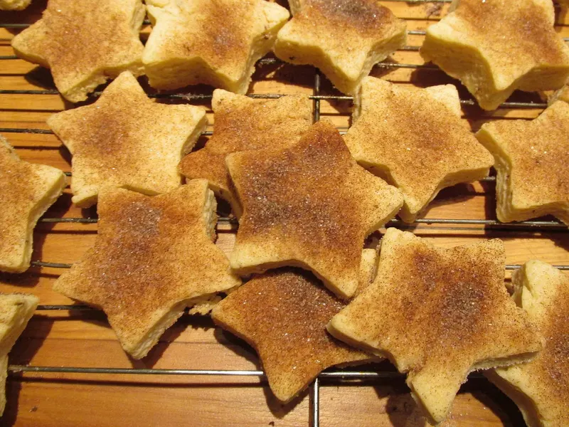A fresh batch of cinnamon-sugar biscochitos on a cooling rack in Albuquerque