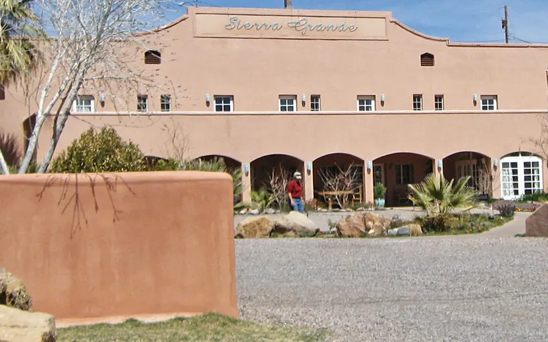 The adobe facade and entrance of Sierra Grande Lodge in Truth or Consequences