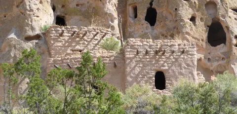 A reconstructed cliff house beneath the tuff cliffs at Bandelier
