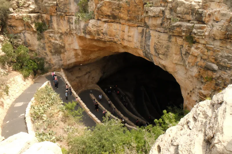 Visitors following the paved switchbacks into the Natural Entrance of Carlsbad Cavern