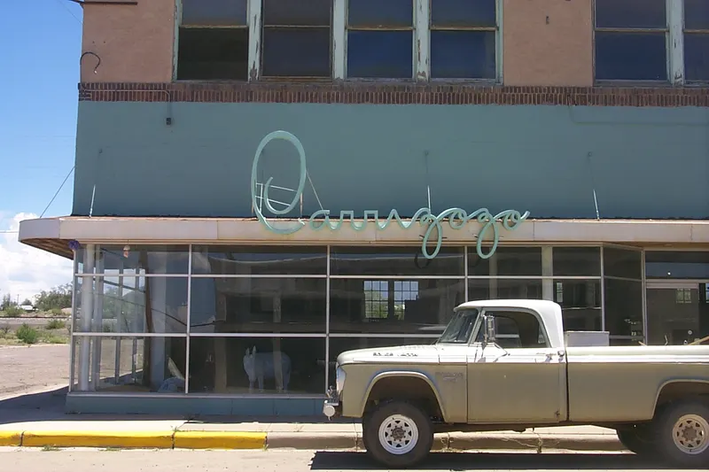 A vintage pickup parked outside a Carrizozo storefront, photographed in 2006